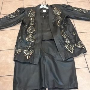 Black ladies 100% leather jacket,vest, skirt.